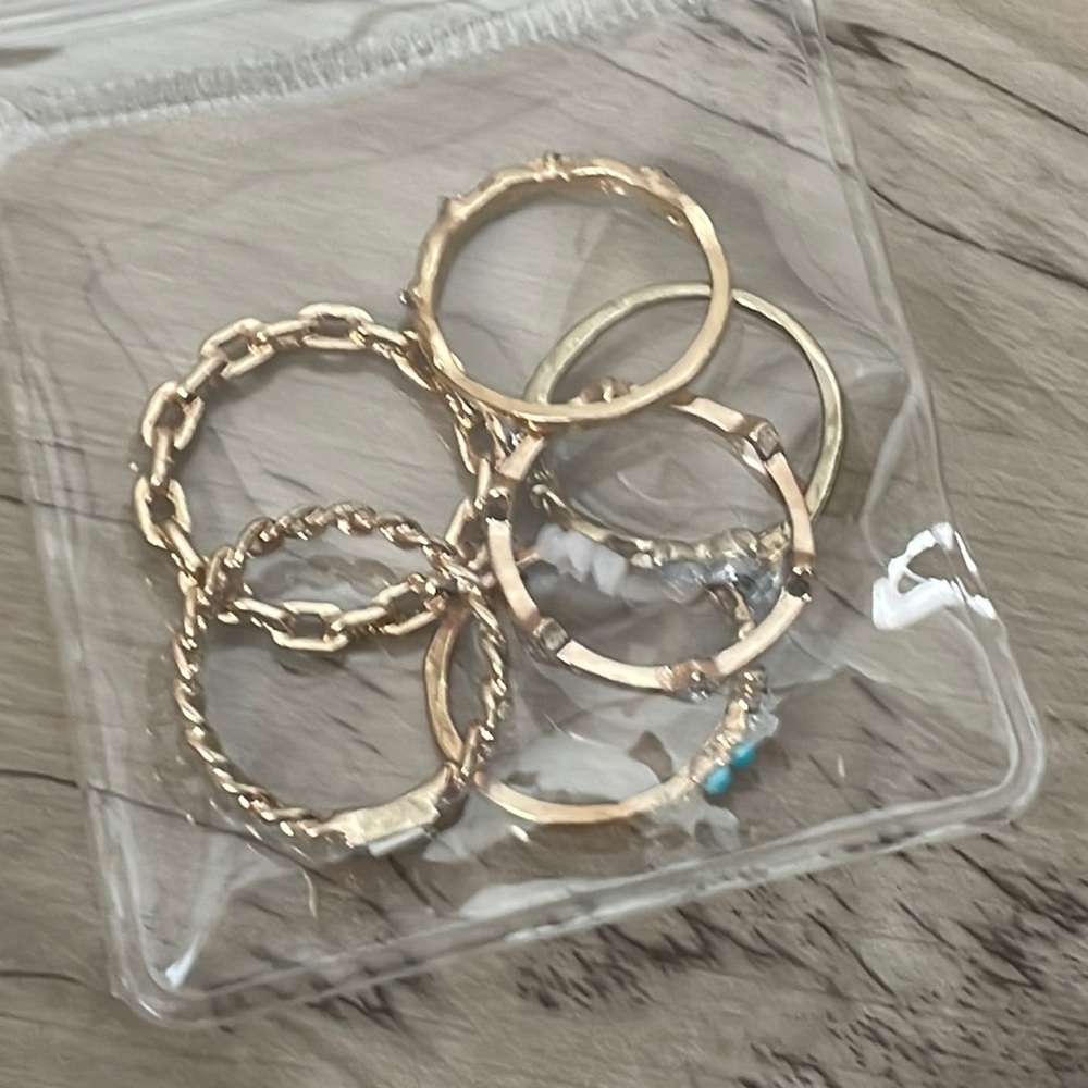 Set of six aluminum gold rings.